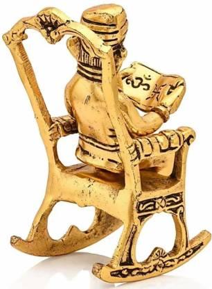 Golden Lord Ganesha Statue Sitting On A Rocking Chair And Reading Ramayan Showpiece - VAYARA