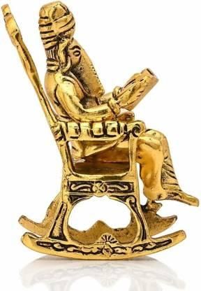 Golden Lord Ganesha Statue Sitting On A Rocking Chair And Reading Ramayan Showpiece - VAYARA
