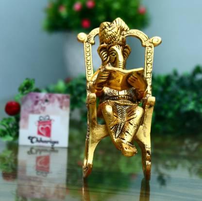 Golden Lord Ganesha Statue Sitting On A Rocking Chair And Reading Ramayan Showpiece - VAYARA